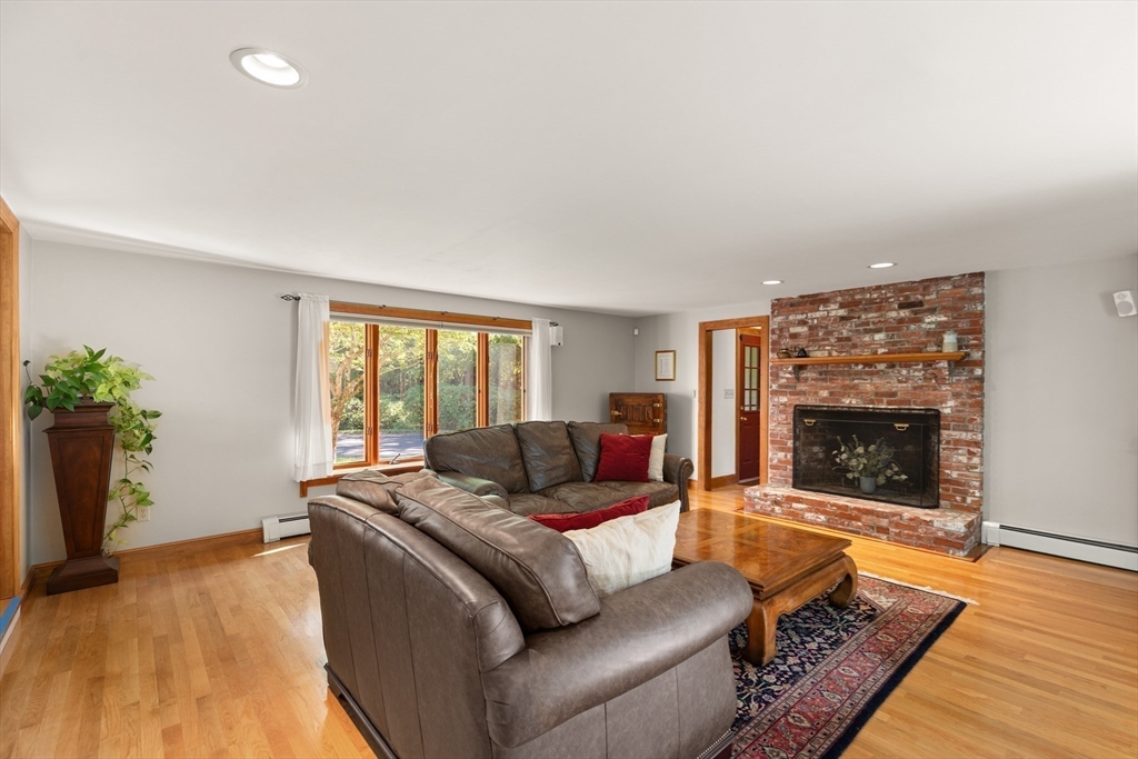 148 Ipswich Road Boxford, MA 01921 - Photo 21 of 42 a living room with furniture and a fireplace