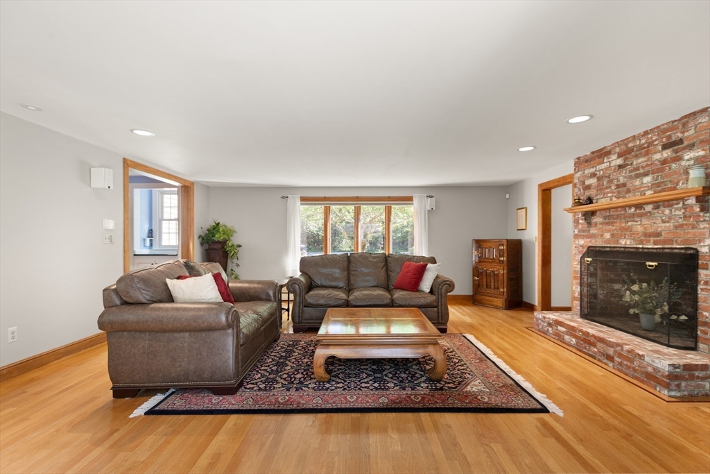 148 Ipswich Road Boxford, MA 01921 - Photo 22 of 42 a living room with furniture and a fireplace