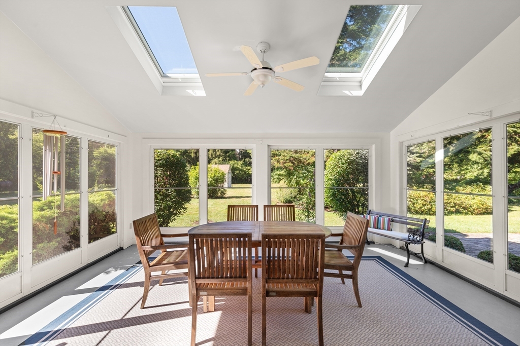 148 Ipswich Road Boxford, MA 01921 - Photo 23 of 42 a view of a dining room with furniture large windows and wooden floor