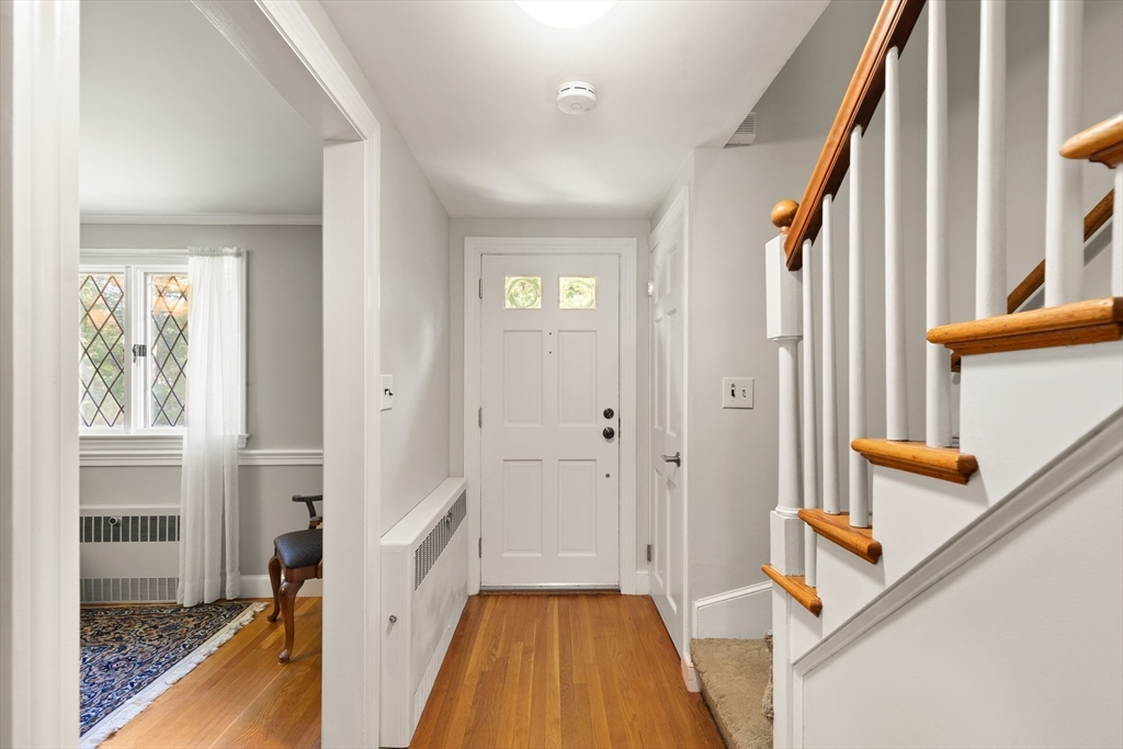 148 Ipswich Road Boxford, MA 01921 - Photo 25 of 42 a view of a hallway with wooden floor and staircase