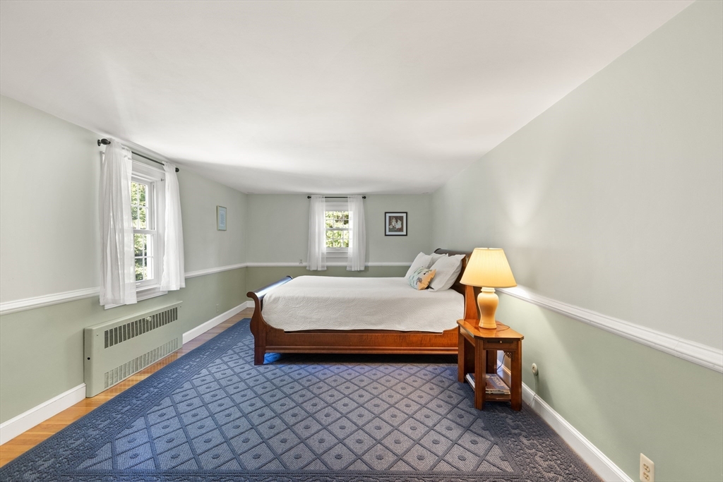 148 Ipswich Road Boxford, MA 01921 - Photo 29 of 42 a bedroom with a bed and a window