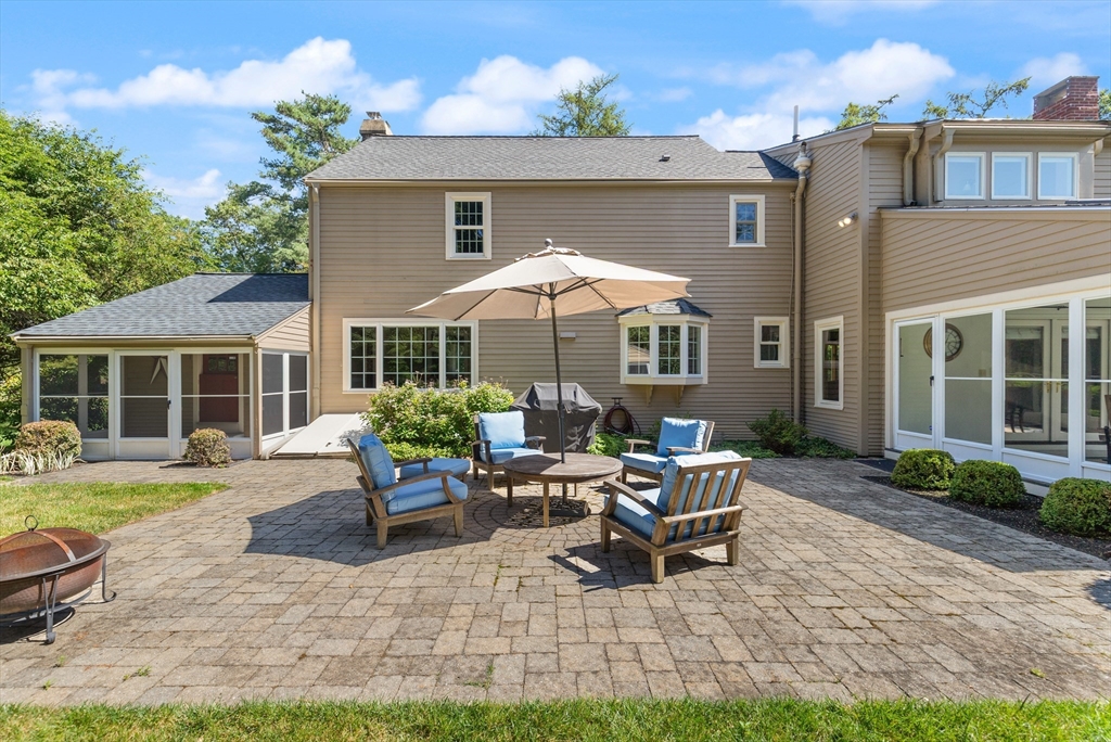 148 Ipswich Road Boxford, MA 01921 - Photo 3 of 42 a backyard of a house with a garden and barbeque oven