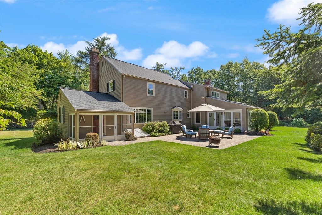 148 Ipswich Road Boxford, MA 01921 - Photo 4 of 42 a front view of a house with garden and trees