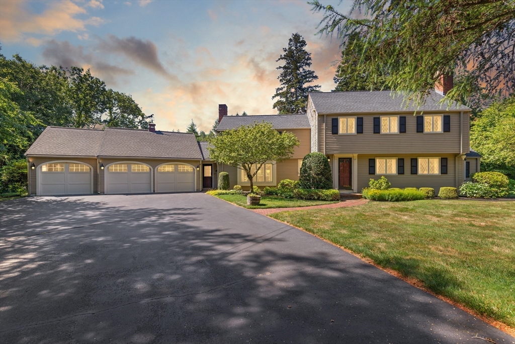 148 Ipswich Road Boxford, MA 01921 - Photo 42 of 42 a front view of a house with a yard and garage