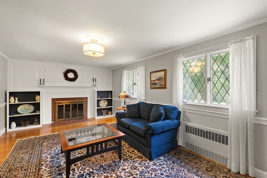 148 Ipswich Road Boxford, MA 01921 - Photo 10 of 42 a living room with furniture a window and a fireplace