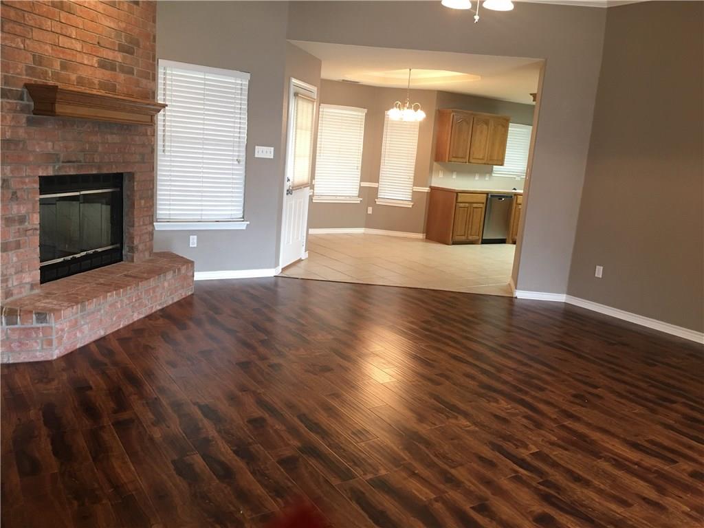 2218 Old Ironsides Road Abilene, TX 79601 - Photo 4 of 26 a view of an empty room with a fireplace and a window