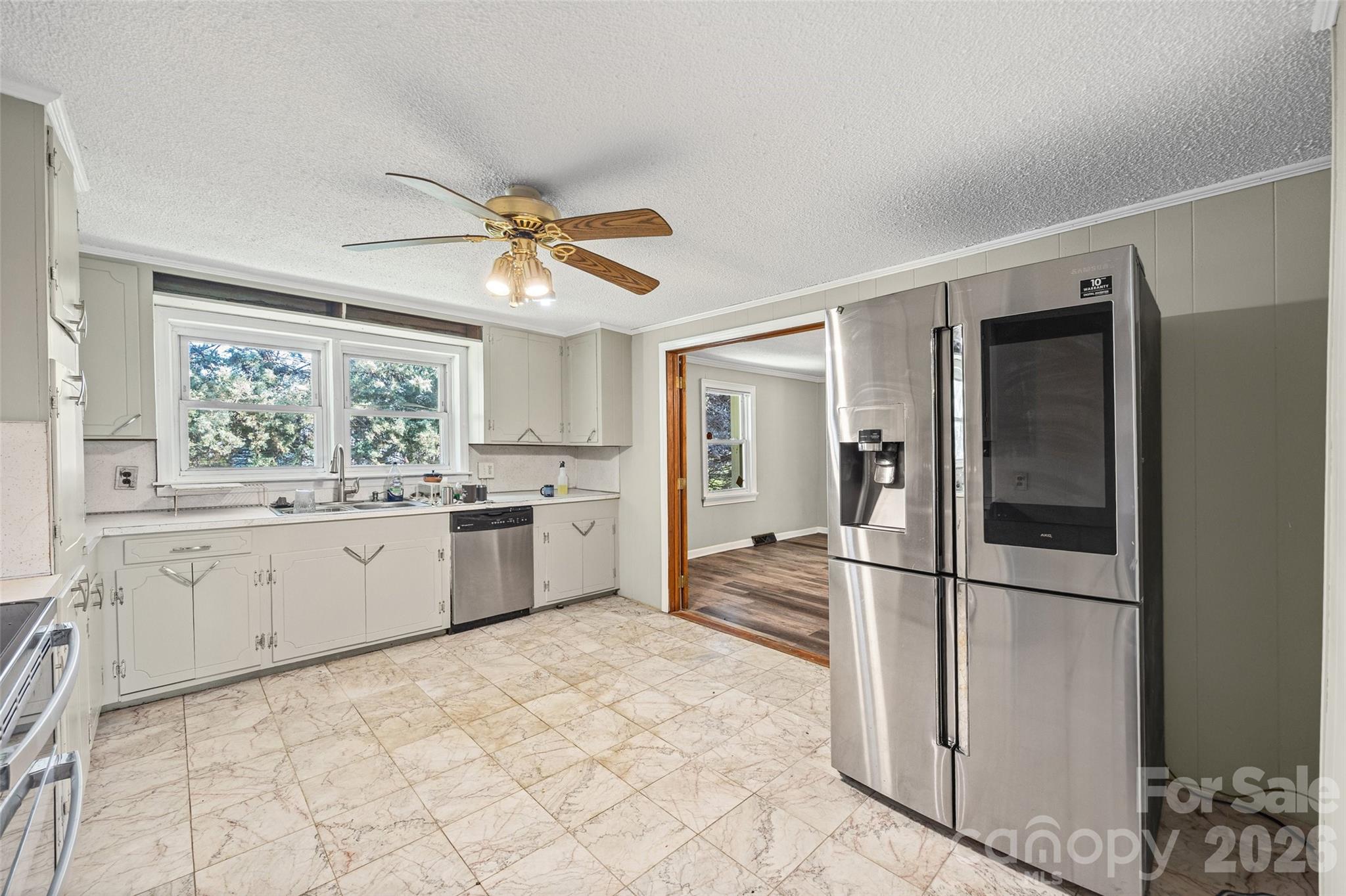 1315 Lithia Springs Road Shelby, NC 28150 - Photo 12 of 25 a kitchen with a refrigerator a stove top oven and a window