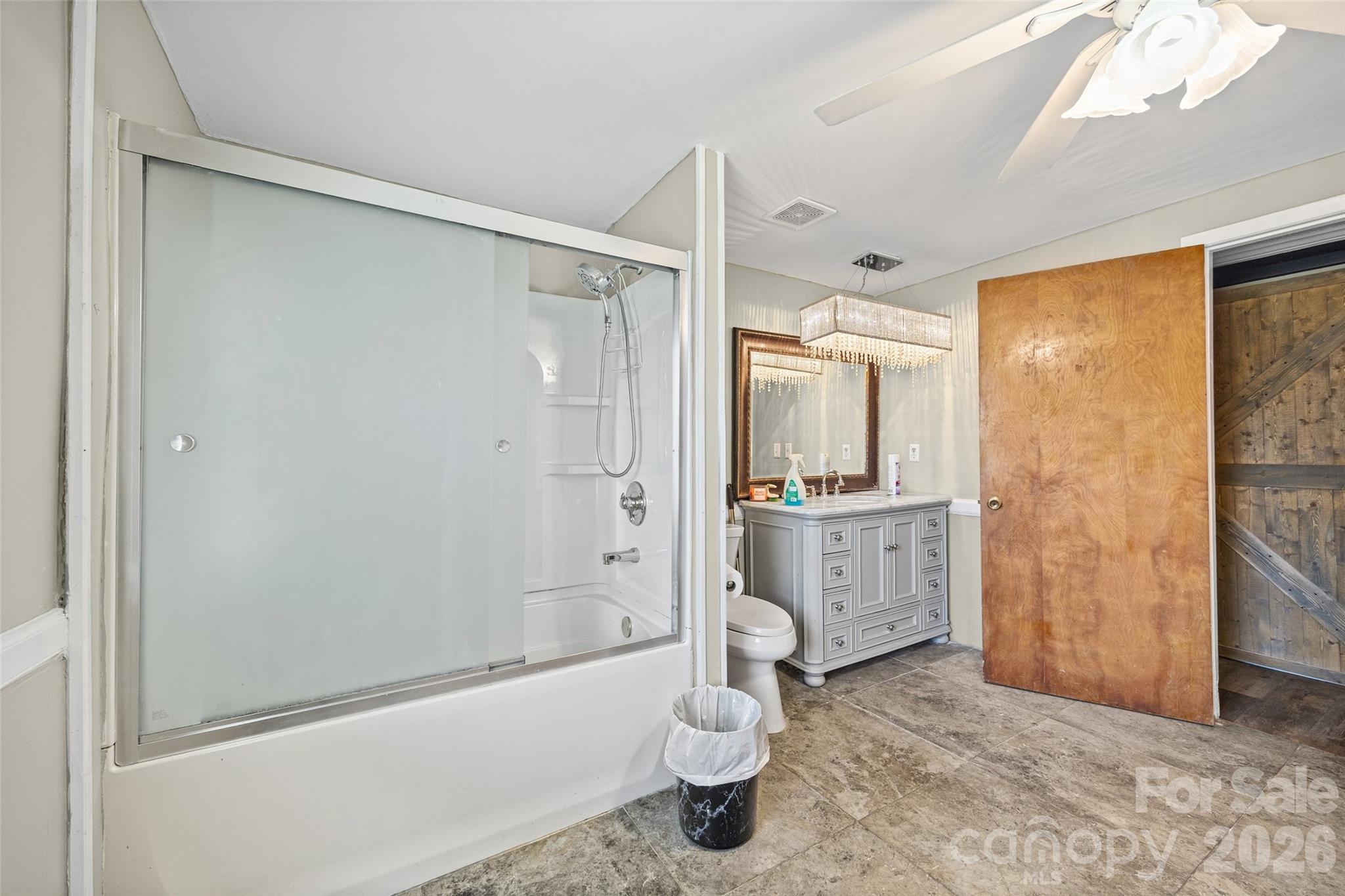 1315 Lithia Springs Road Shelby, NC 28150 - Photo 15 of 25 a bathroom with a granite countertop sink toilet and shower