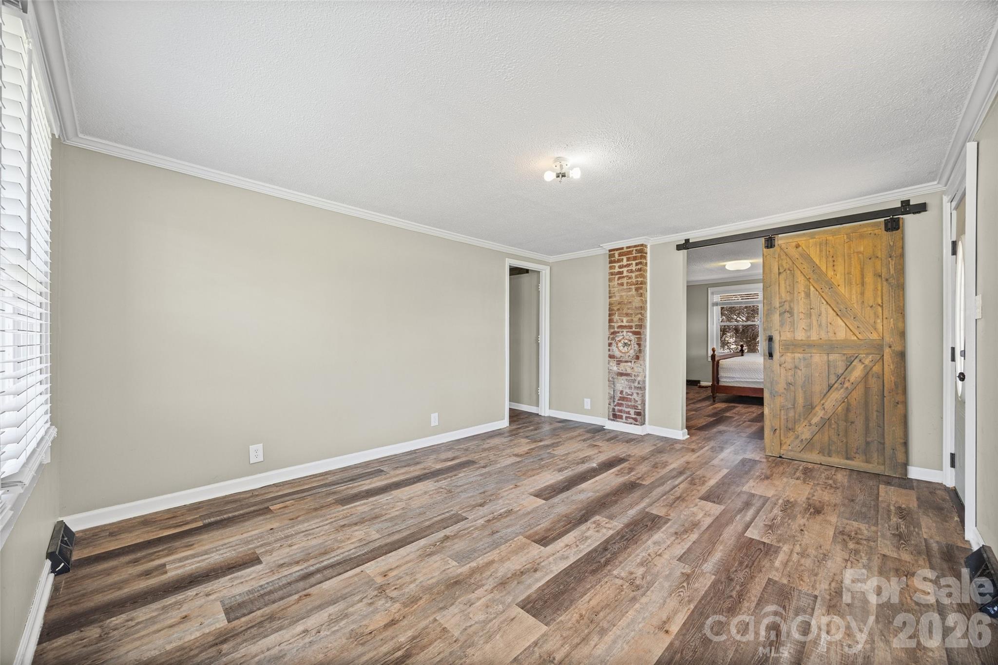 1315 Lithia Springs Road Shelby, NC 28150 - Photo 6 of 25 a view of empty room with wooden floor and fan
