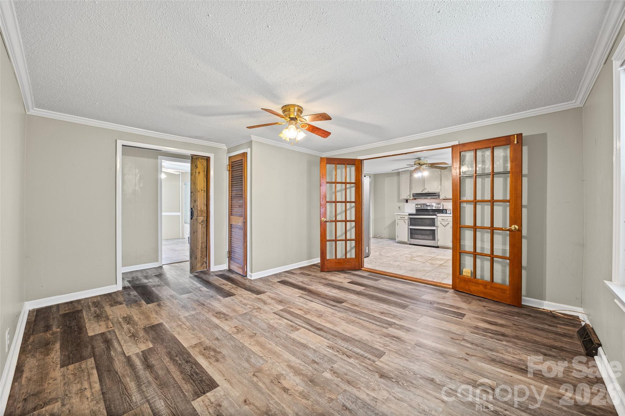 1315 Lithia Springs Road Shelby, NC 28150 - Photo 10 of 25 a view of an empty room with a window and wooden floor