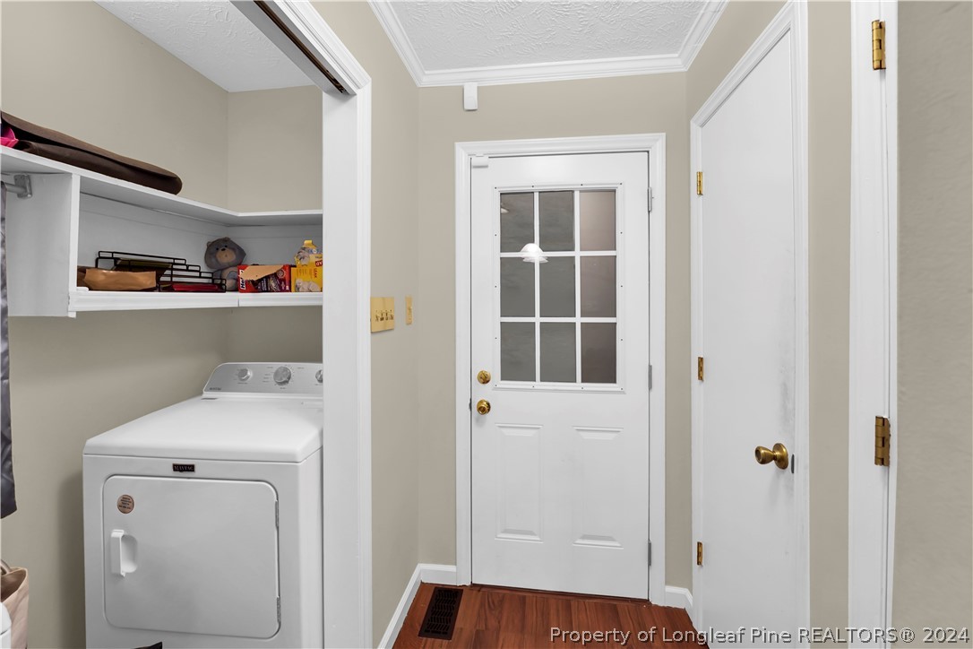 480 Rockfish Road Raeford, NC 28376 - Photo 13 of 30 a view of storage and utility room with washer and dryer