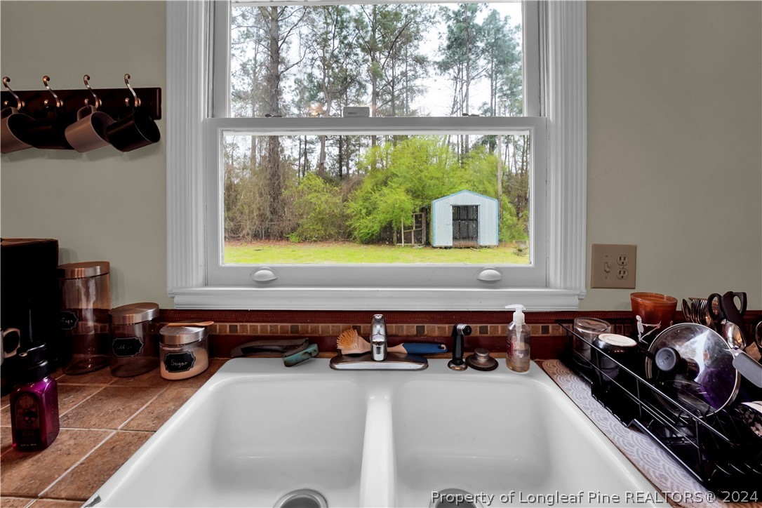 480 Rockfish Road Raeford, NC 28376 - Photo 15 of 30 a room with furniture and flat screen tv