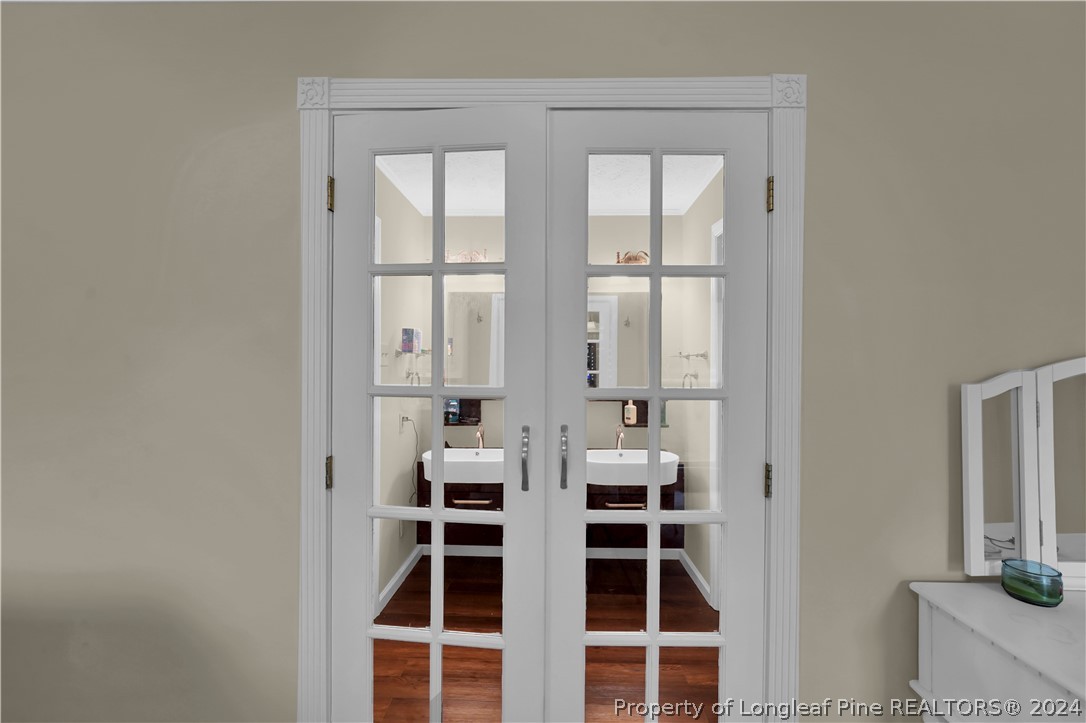 480 Rockfish Road Raeford, NC 28376 - Photo 25 of 30 a view of wooden floor and windows in a room