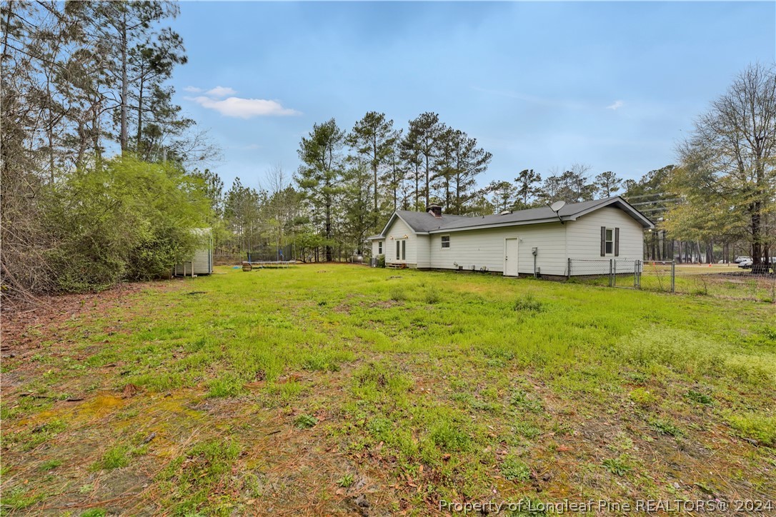 480 Rockfish Road Raeford, NC 28376 - Photo 29 of 30 a view of a house with a yard