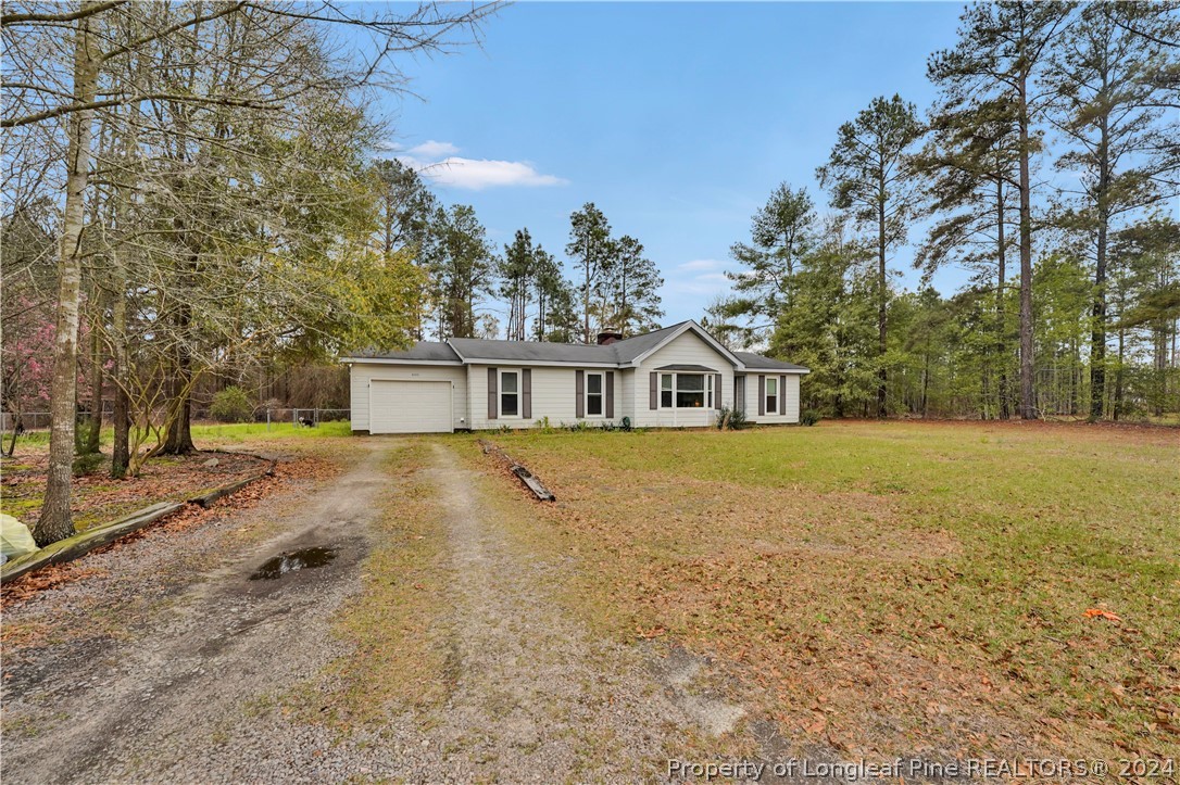 480 Rockfish Road Raeford, NC 28376 - Photo 3 of 30 a front view of a house with a yard