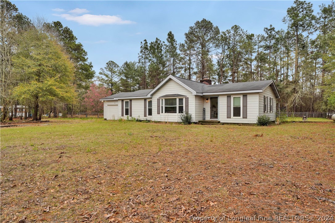480 Rockfish Road Raeford, NC 28376 - Photo 6 of 30 a view of a house with a yard