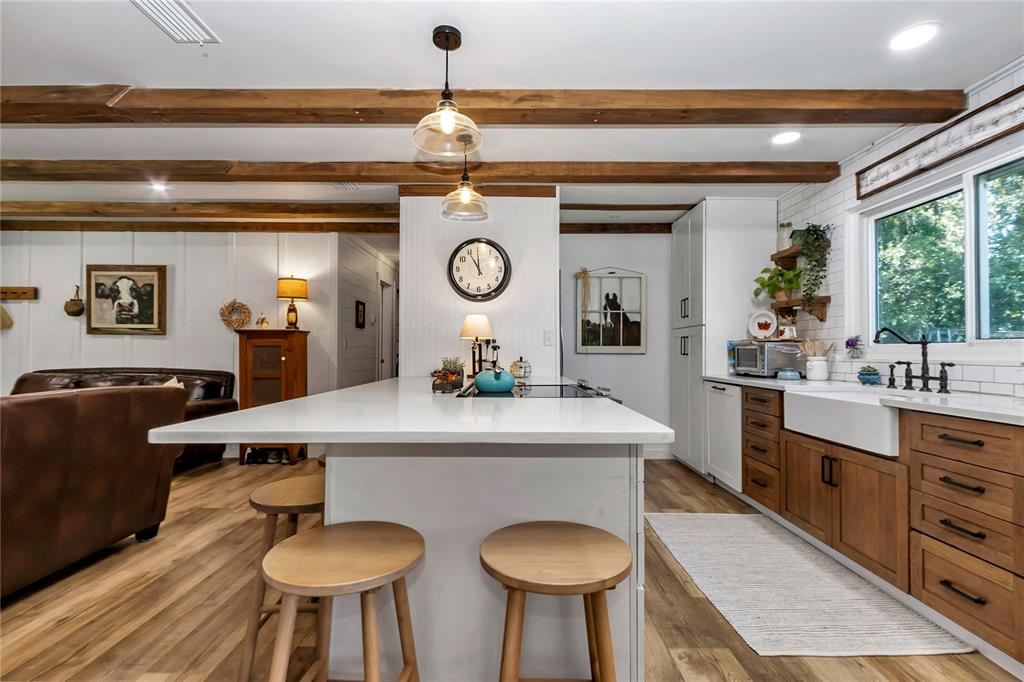 13232 Northeast 39th Terrace Anthony, FL 32617 - Photo 11 of 55 a living room with furniture and a clock