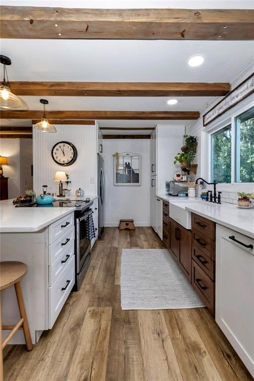 13232 Northeast 39th Terrace Anthony, FL 32617 - Photo 12 of 55 a large kitchen with stainless steel appliances a large counter top