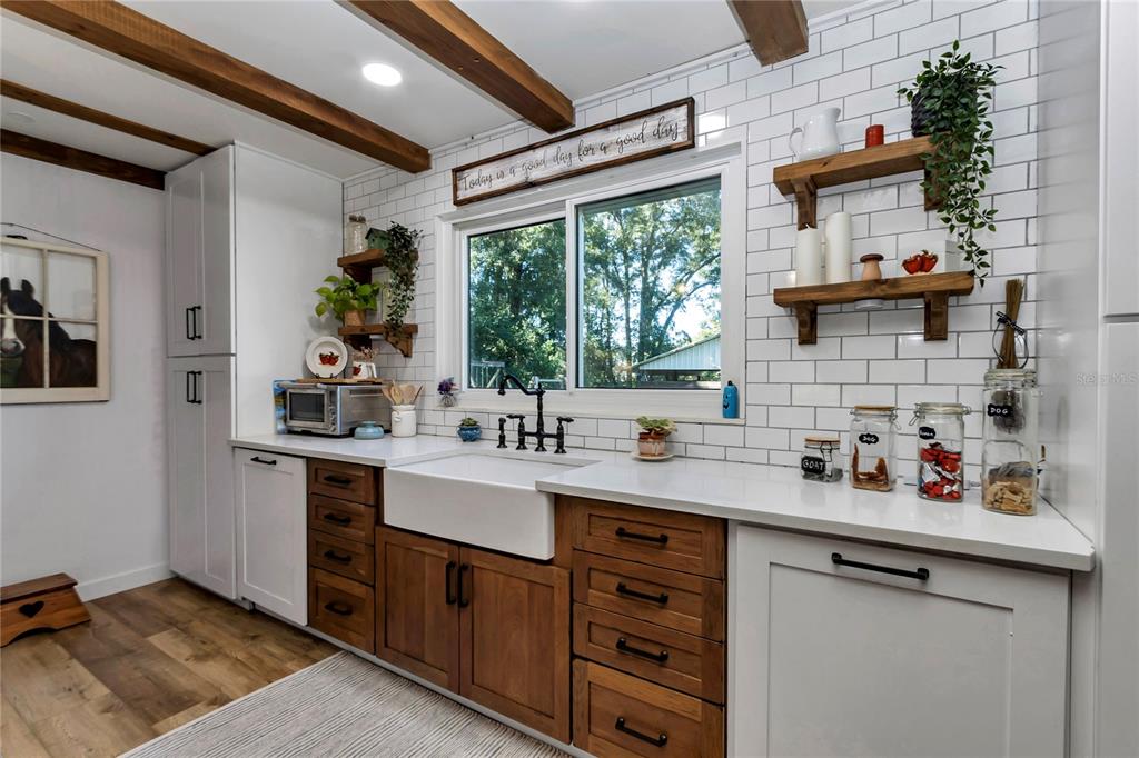 13232 Northeast 39th Terrace Anthony, FL 32617 - Photo 14 of 55 a kitchen with a sink cabinets and window