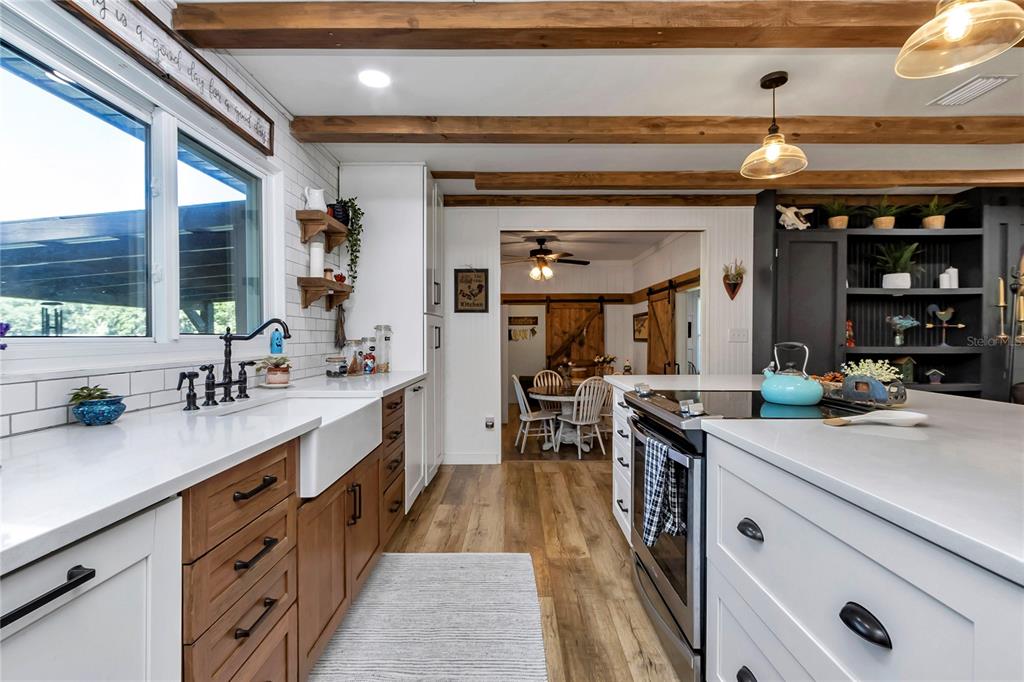 13232 Northeast 39th Terrace Anthony, FL 32617 - Photo 16 of 55 a kitchen with a sink and stove