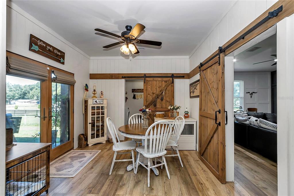 13232 Northeast 39th Terrace Anthony, FL 32617 - Photo 17 of 55 a view of a dining room with furniture window and wooden floor