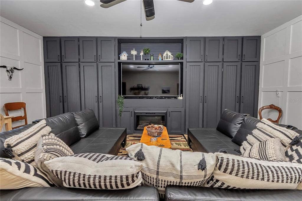 13232 Northeast 39th Terrace Anthony, FL 32617 - Photo 20 of 55 a living room with furniture and a fireplace