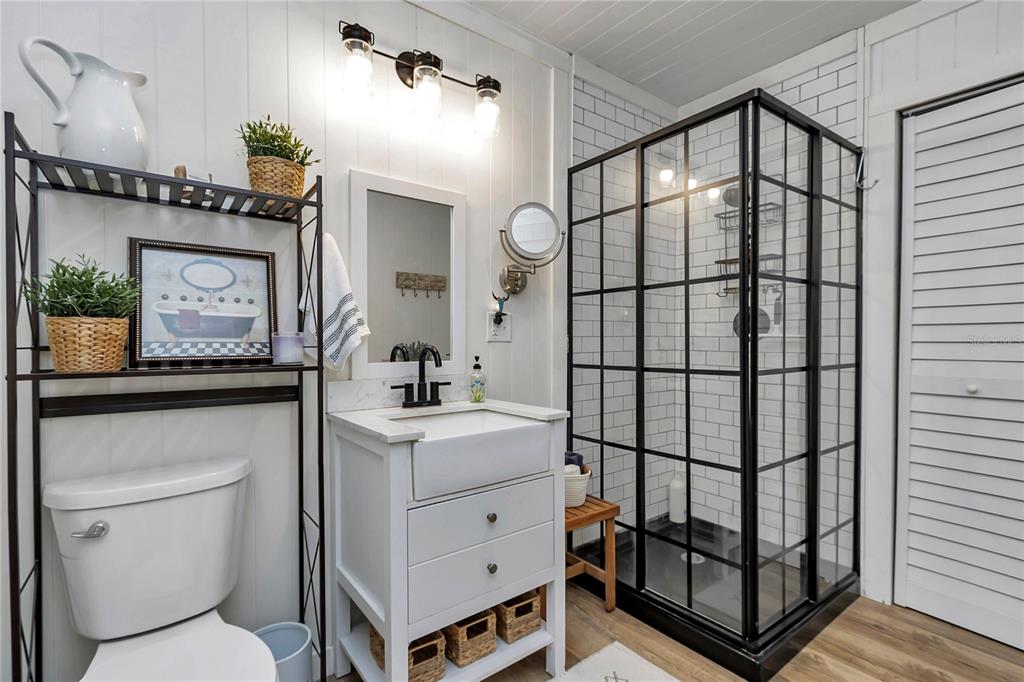 13232 Northeast 39th Terrace Anthony, FL 32617 - Photo 23 of 55 a bathroom with a sink a toilet and shower