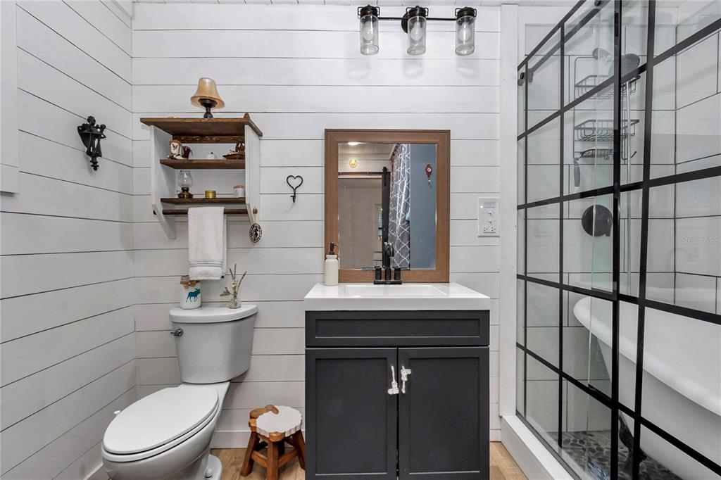 13232 Northeast 39th Terrace Anthony, FL 32617 - Photo 29 of 55 a bathroom with a toilet sink and mirror