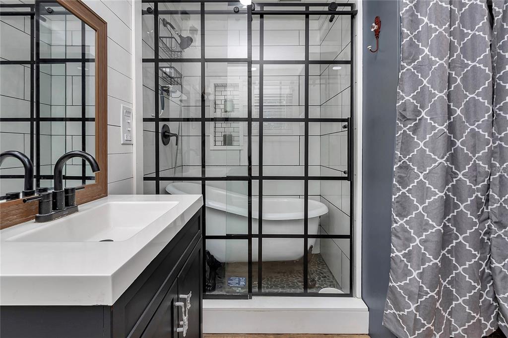 13232 Northeast 39th Terrace Anthony, FL 32617 - Photo 30 of 55 a bathroom with a sink and a large mirror