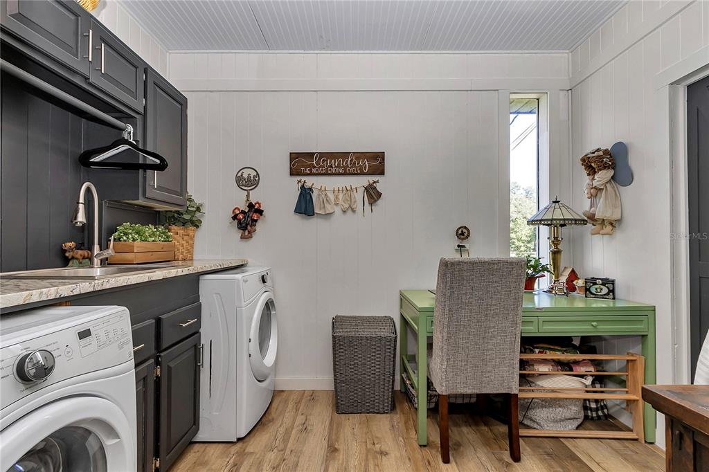 13232 Northeast 39th Terrace Anthony, FL 32617 - Photo 31 of 55 a view of a dining room with furniture a rug and wooden floor