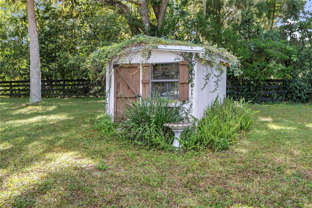 13232 Northeast 39th Terrace Anthony, FL 32617 - Photo 33 of 55 a front view of a house with garden