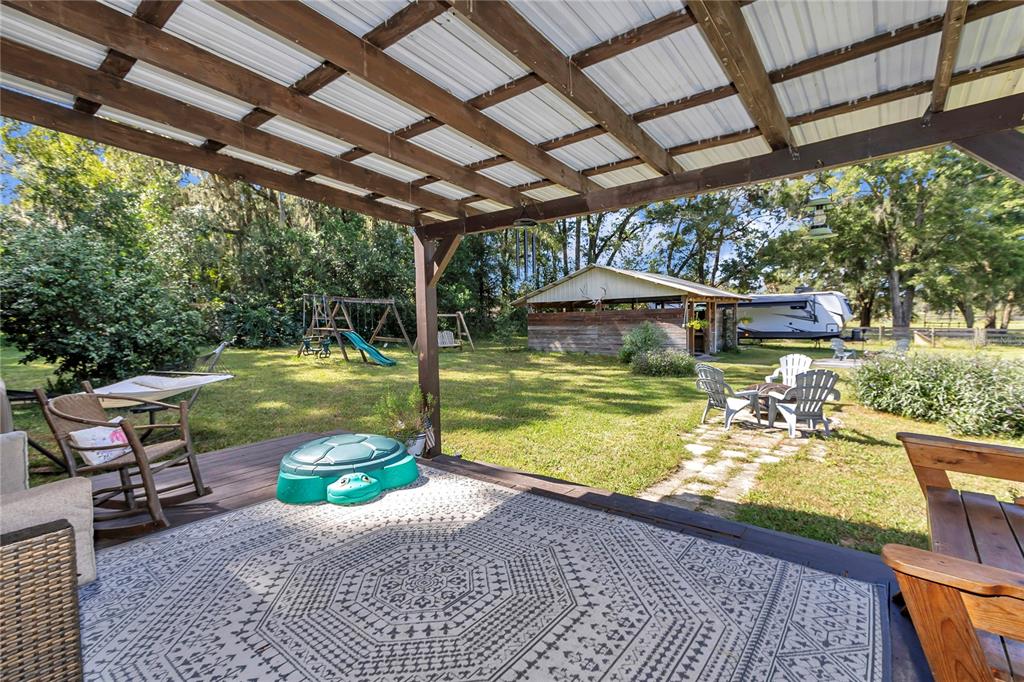 13232 Northeast 39th Terrace Anthony, FL 32617 - Photo 34 of 55 a view of a swimming pool with a patio