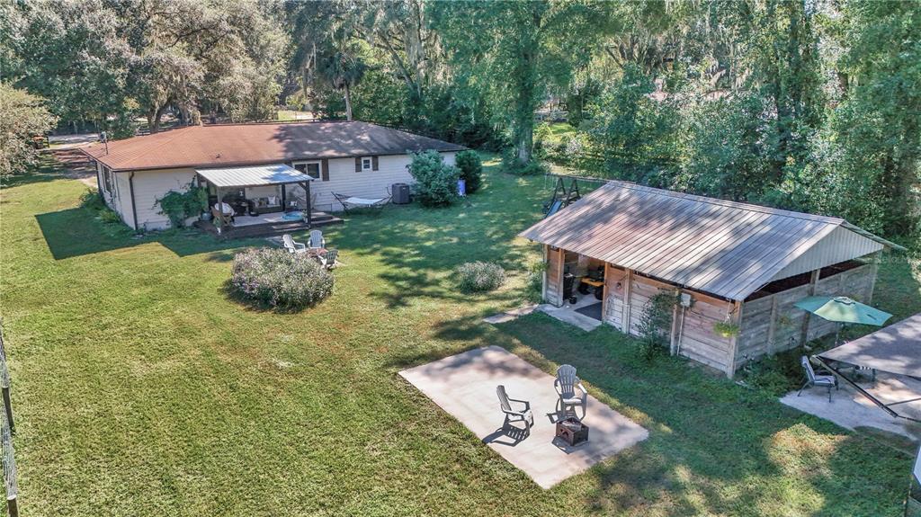 13232 Northeast 39th Terrace Anthony, FL 32617 - Photo 36 of 55 an aerial view of a house with a yard basket ball court and outdoor seating