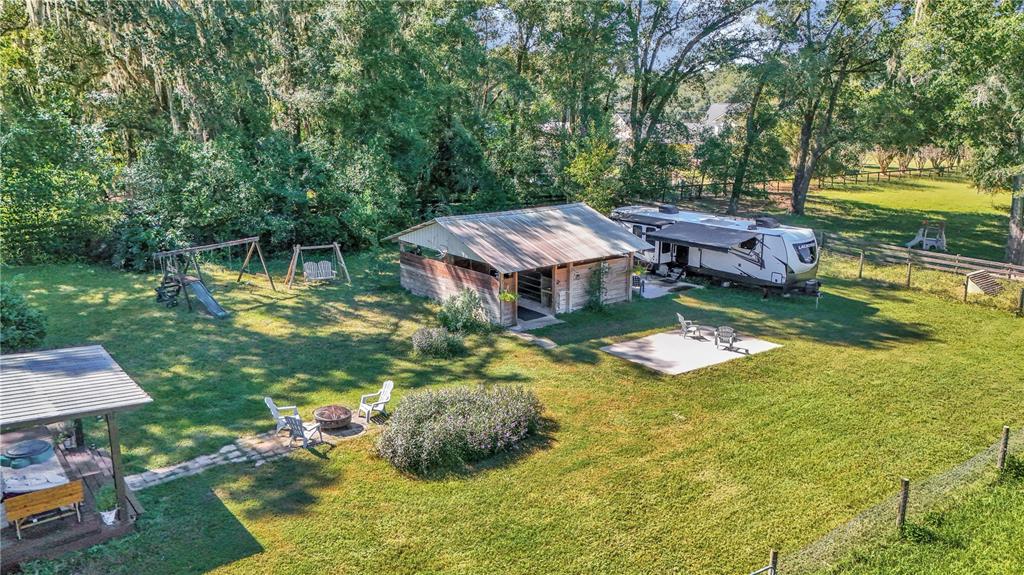 13232 Northeast 39th Terrace Anthony, FL 32617 - Photo 46 of 55 an aerial view of a house with swimming pool garden and outdoor seating