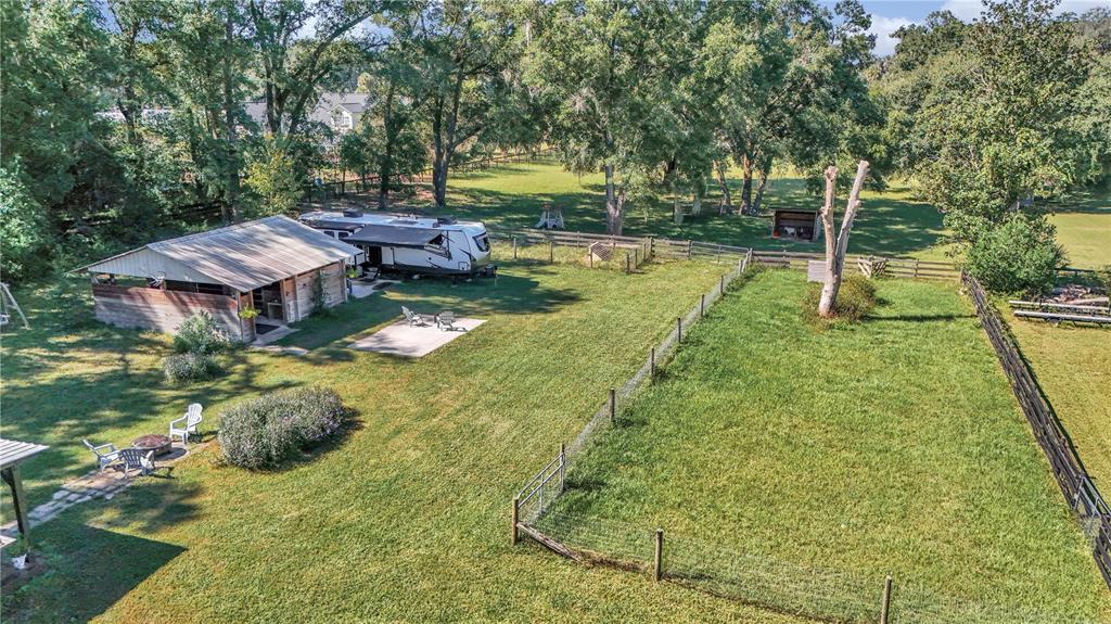 13232 Northeast 39th Terrace Anthony, FL 32617 - Photo 47 of 55 a backyard of a house with table and chairs