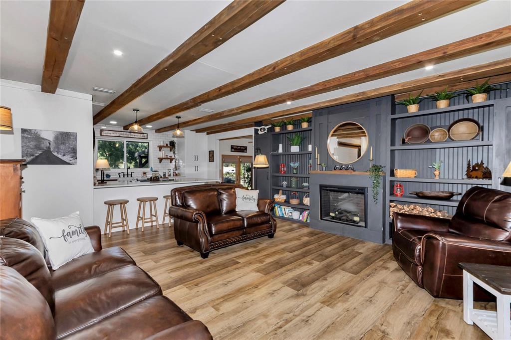 13232 Northeast 39th Terrace Anthony, FL 32617 - Photo 5 of 55 a living room with furniture and a fireplace