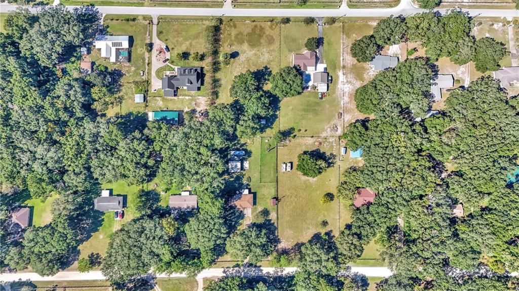 13232 Northeast 39th Terrace Anthony, FL 32617 - Photo 52 of 55 an aerial view of a multi story building with yard