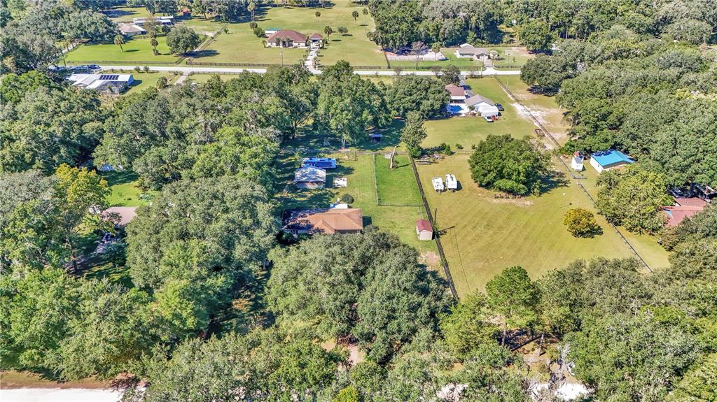 13232 Northeast 39th Terrace Anthony, FL 32617 - Photo 54 of 55 an aerial view of residential house with outdoor space and trees all around