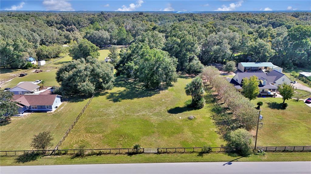 13232 Northeast 39th Terrace Anthony, FL 32617 - Photo 55 of 55 an aerial view of a houses with a yard