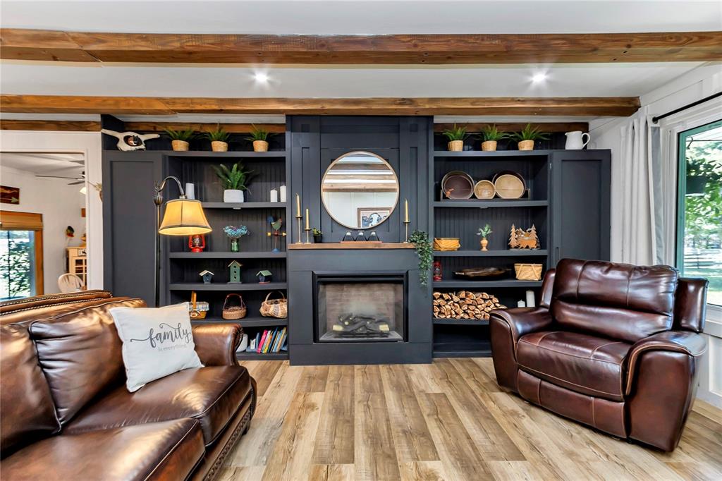 13232 Northeast 39th Terrace Anthony, FL 32617 - Photo 7 of 55 a living room with furniture and a fireplace