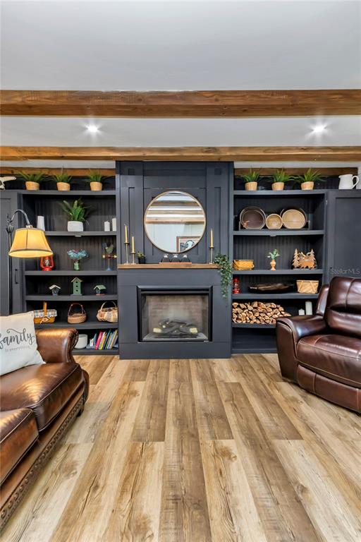 13232 Northeast 39th Terrace Anthony, FL 32617 - Photo 8 of 55 a living room with furniture and a fireplace