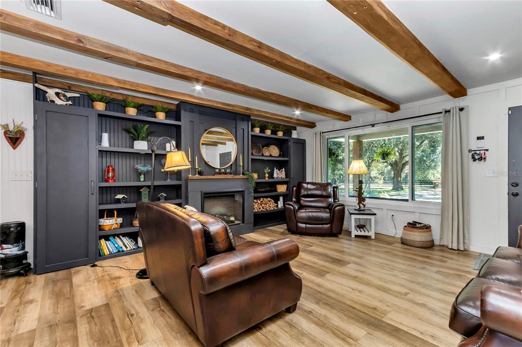 13232 Northeast 39th Terrace Anthony, FL 32617 - Photo 9 of 55 a living room with furniture and a large window