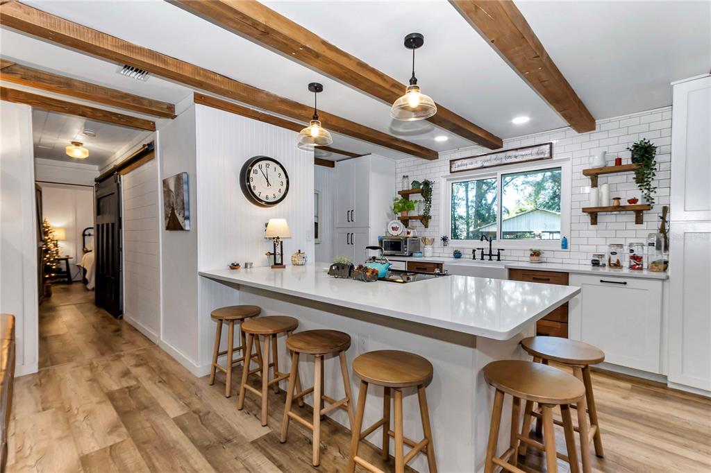 13232 Northeast 39th Terrace Anthony, FL 32617 - Photo 10 of 55 a dining hall with stainless steel appliances granite countertop a sink and a large window