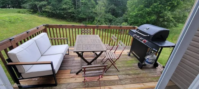 swimming pool view with a seating space