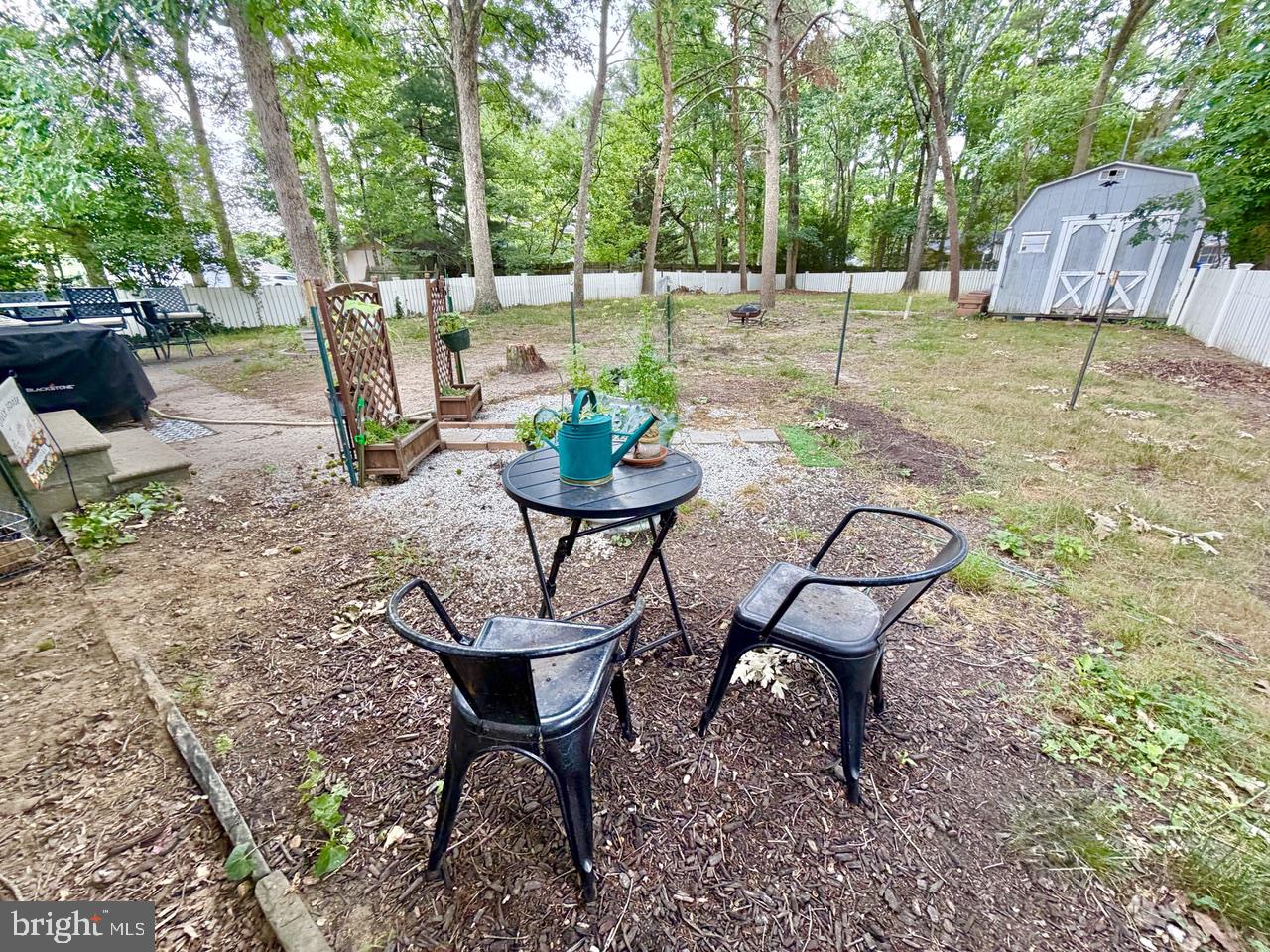 2413 Shelburn Road Millville, NJ 08332 - Photo 38 of 41 a backyard of a house with table and chairs