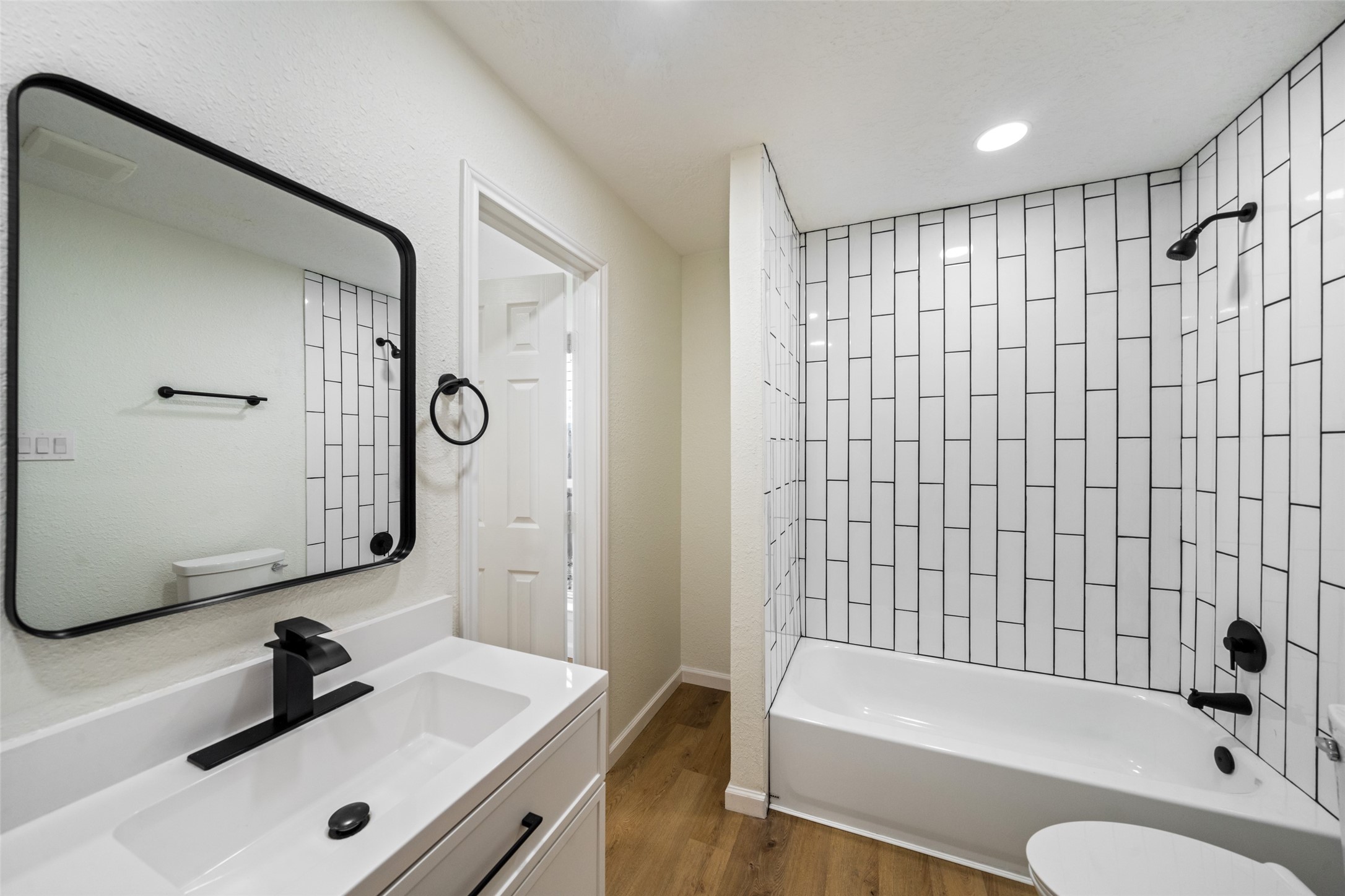 238 Point Clear Drive Conroe, TX 77304 - Photo 13 of 20 a bathroom with a bathtub shower sink vanity and toilet