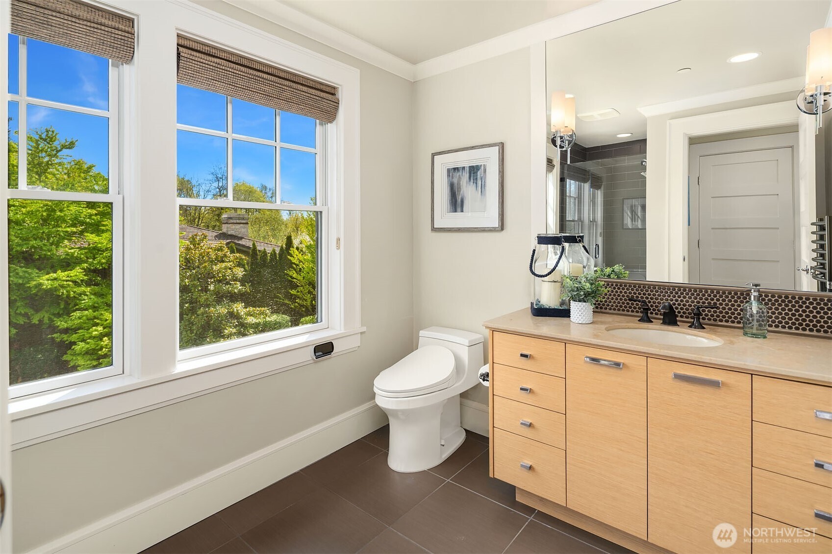 8910 Northeast 33rd Street Yarrow Point, WA 98004 - Photo 23 of 38 a bathroom with a toilet sink and mirror