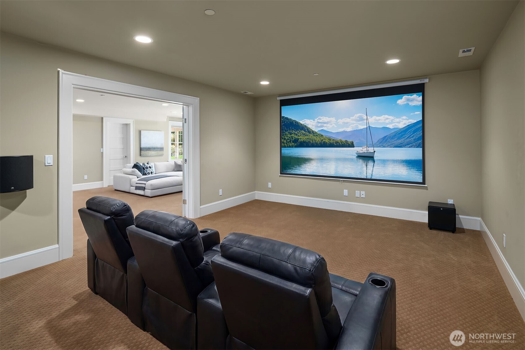 8910 Northeast 33rd Street Yarrow Point, WA 98004 - Photo 33 of 38 a living room with furniture and a flat screen tv