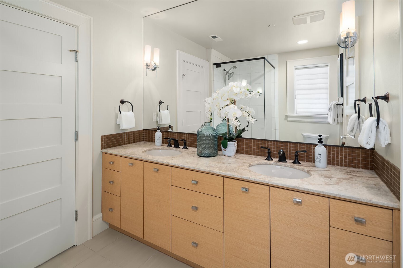 8910 Northeast 33rd Street Yarrow Point, WA 98004 - Photo 35 of 38 a bathroom with double sink and a mirror