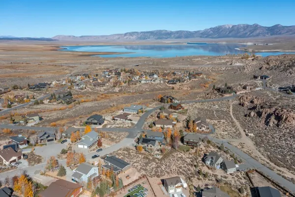 an aerial view of a house with a lake view